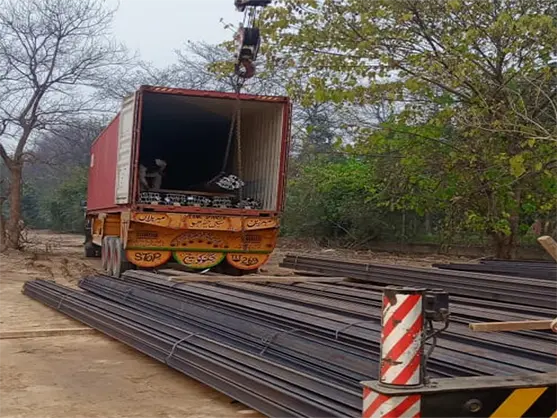 Local-crew-unloading-rail-bundles-at-project-site